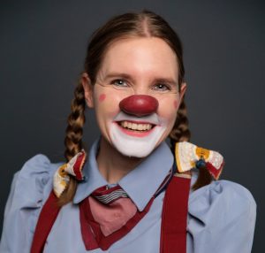 Actress Pamela Pilawa in Multicultural Clown Costume showcasing her family friendly multilingual theatre shows in Sydney