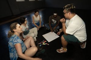 Corporate Team Building for Utopia Rising showing participants engaged in the Improv Workshop by Pamela Pilawa in Sydney