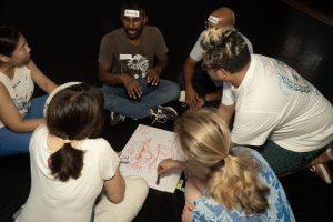 Corporate Team Building for Utopia Rising showing participants engaged in the Improv Workshop by Pamela Pilawa in Sydney