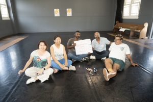 Corporate Team Building for Utopia Rising showing participants engaged in the Improv Workshop by Pamela Pilawa in Sydney