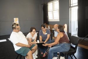 Corporate Team Building for Utopia Rising showing participants engaged in the Improv Workshop by Pamela Pilawa in Sydney