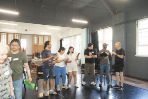 Corporate Team Building for Utopia Rising showing participants engaged in the Improv Workshop by Pamela Pilawa in Sydney