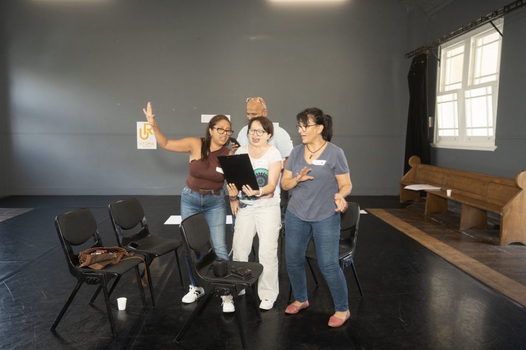 Corporate Team Building for Utopia Rising showing participants engaged in the Improv Workshop by Pamela Pilawa in Sydney