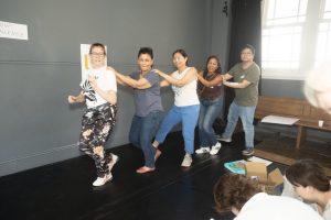 Corporate Team Building for Utopia Rising showing participants engaged in the Improv Workshop by Pamela Pilawa in Sydney