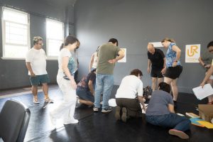 Corporate Team Building for Utopia Rising showing participants engaged in the Improv Workshop by Pamela Pilawa in Sydney