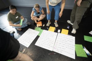 Corporate Team Building for Utopia Rising showing participants engaged in the Improv Workshop by Pamela Pilawa in Sydney