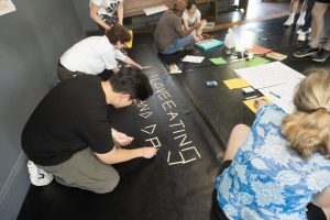 Corporate Team Building for Utopia Rising showing participants engaged in the Improv Workshop by Pamela Pilawa in Sydney
