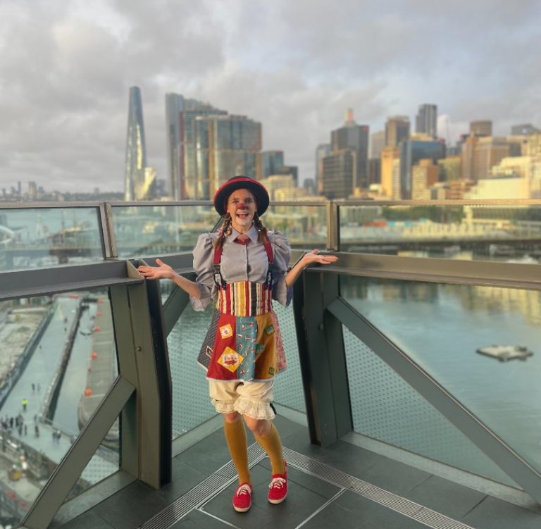 actress Pamela Pilawa posing in clown costume at a corporate roving event in Sydney